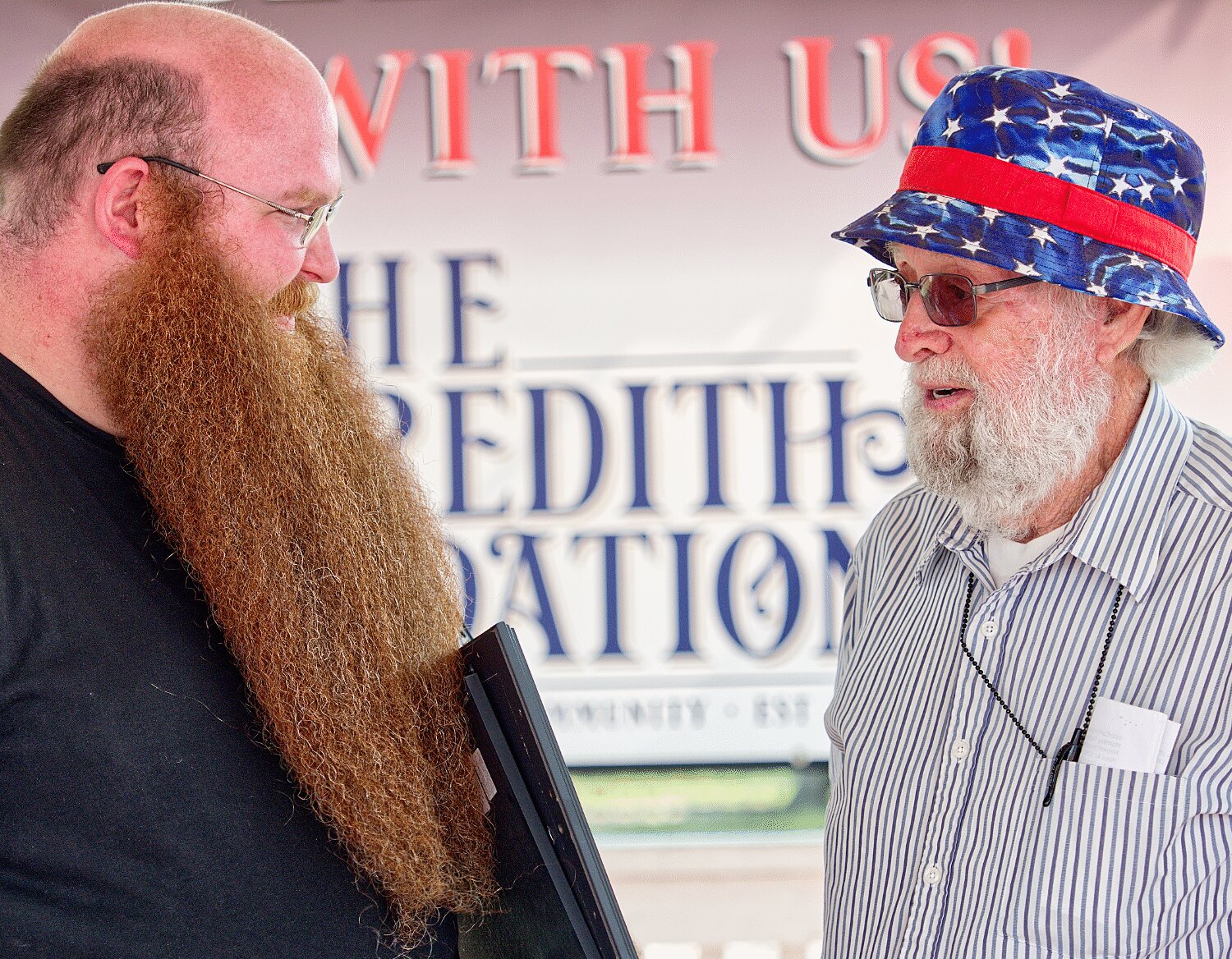Joseph McCord received the prize for longest beard and overall judges choice in the beard masters competition from Sam Arrington, the winner of the contest held 50 years prior at Mineola's centennial. McCord promised Arrington to present the award at the bicentennial competition. [see so many more sesquicentennial spring fling photos]